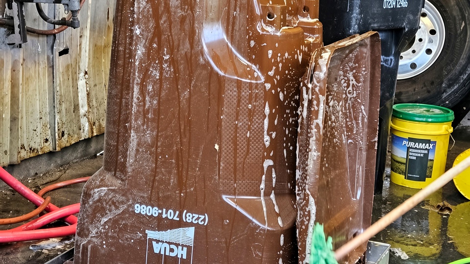 Brown 240 litre bin inverted on the WBW-001 wash stand with soap